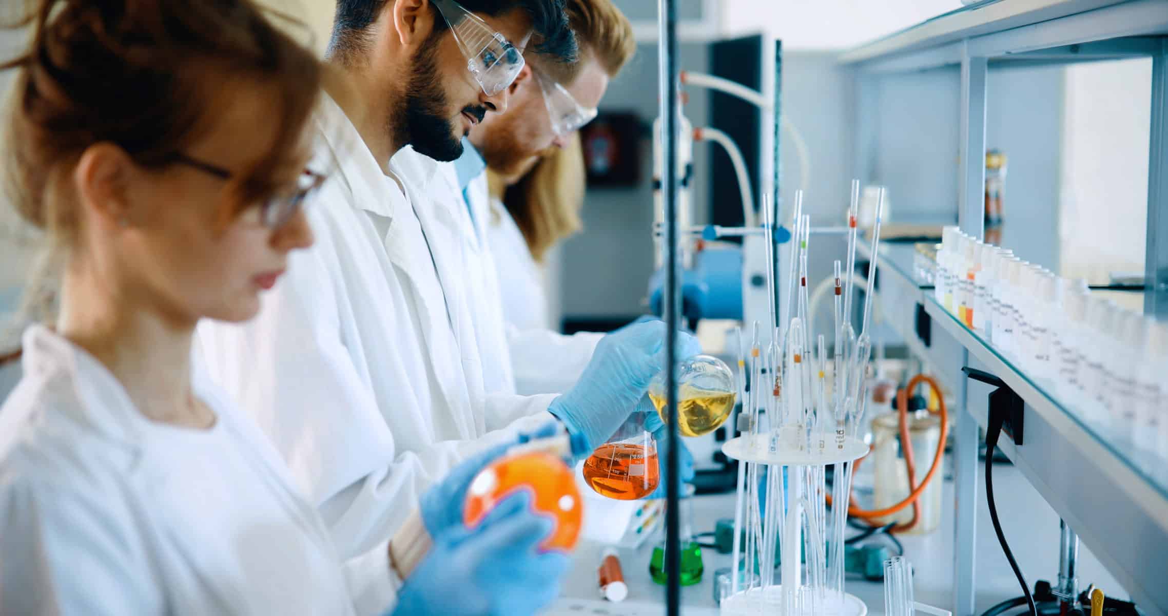 Young students of chemistry working together in laboratory